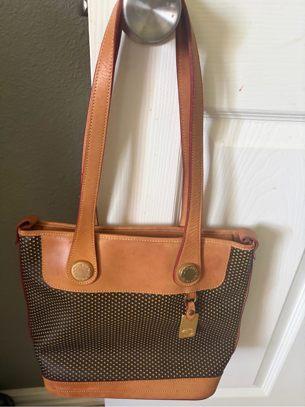 Vintage Dooney and Bourke Cabriolet perforated tan and black